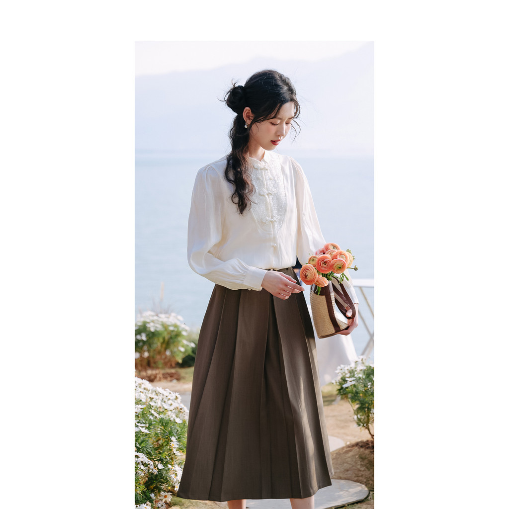 Váy xếp ly Mutu Retro phong cách preppy mới mẻ cho mùa xuân 2026, dáng chữ A vừa phải
