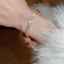 Vòng tay bốn lá cỏ ba lá màu vàng full pave cubic zircon, phong cách thanh lịch phương Tây