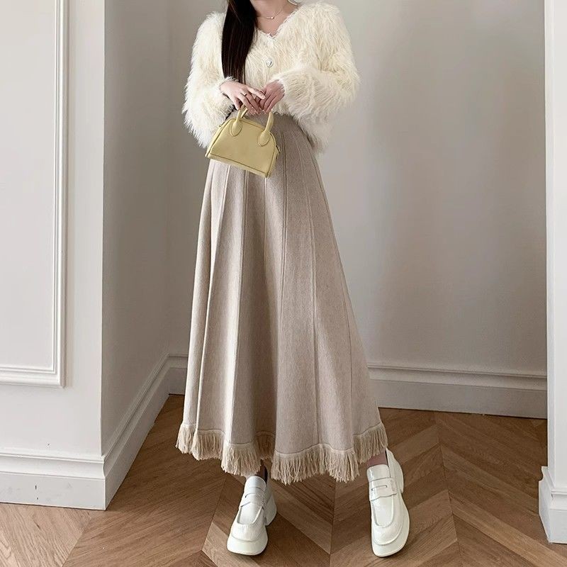 Giữa Đến Dài Thu Đông Tính Khí Dệt Kim Rời Chữ A Váy Có Sợi Nữ Plus Size Tua Rua Cao Cấp Nửa Chiều Dài Váy