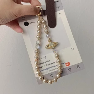 Ánh sáng sang trọng cao cấp nhấp nháy kim cương Saturn Pearl Dây chuyền điện thoại di động diy Đính cườm cổ tay ngắn Dây chuyền túi Niche tinh tế Mặt dây chuyền