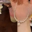 Vòng cổ ngọc trai giác quan tiên tiến thời trang dành cho nữ Cô gái Mặt dây chuyền ngọc trai đơn giản Chuỗi xương đòn Phụ kiện trang sức dự tiệc Quà tặng Mới