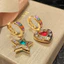 Nhẹ nhàng Tính khí sang trọng Ánh sáng đẹp Bông tai ngôi sao Zircon bất đối xứng sang trọng