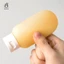 Chai có thể nạp lại Dầu gội tinh chất di động Chai Gel tắm Bộ du lịch Chứa mới