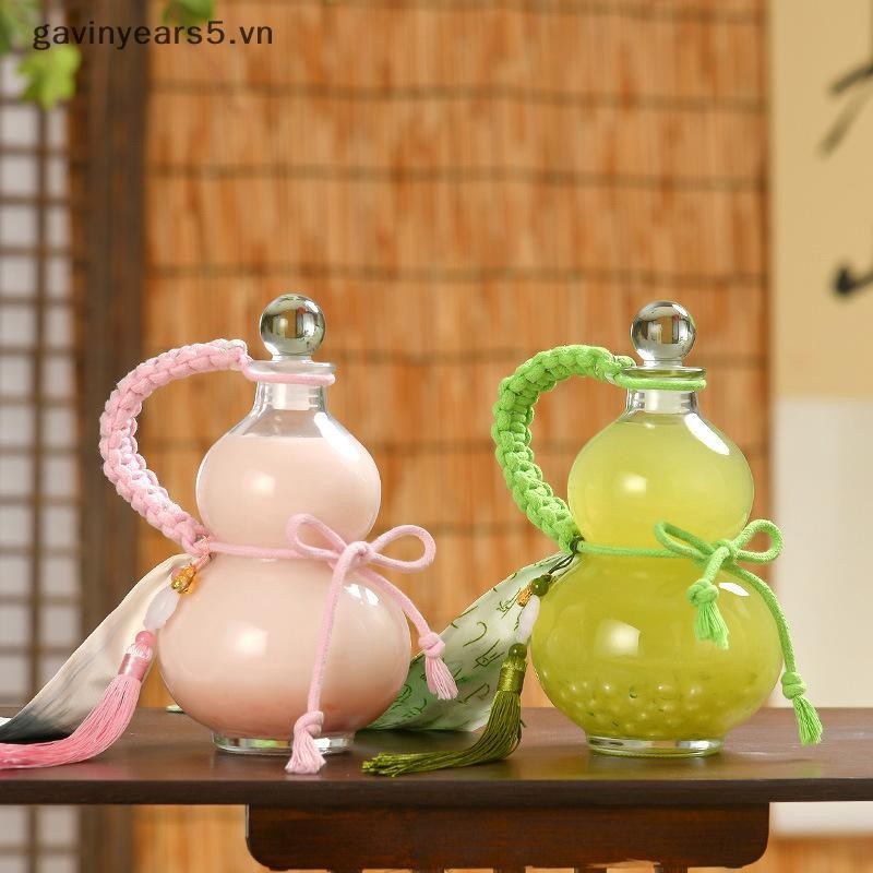 # gavin # Chai rượu thủy tinh Borosilicate cao hình bầu trong suốt Chai rượu thủy tinh chịu nhiệt Chai rỗng có nắp Chai trà sữa Chai pha lạnh.