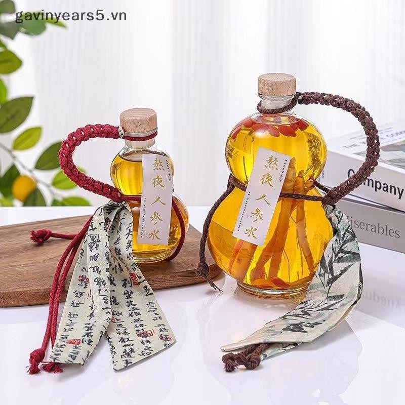 # gavin # Chai rượu thủy tinh Borosilicate cao hình bầu trong suốt Chai rượu thủy tinh chịu nhiệt Chai rỗng có nắp Chai trà sữa Chai pha lạnh.