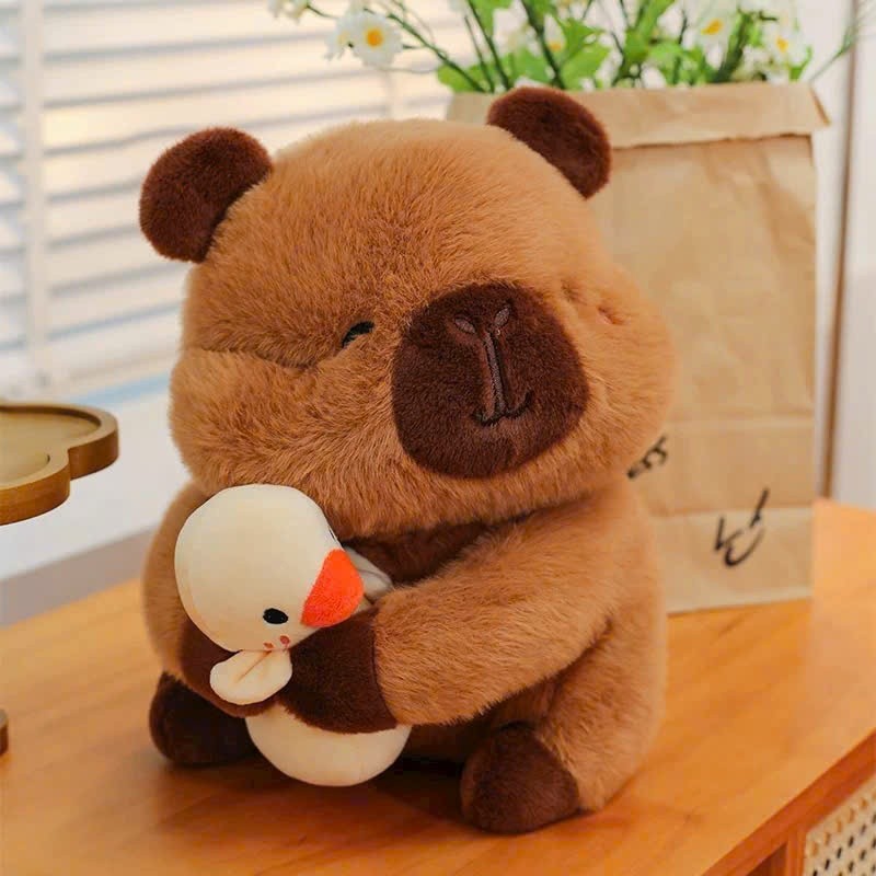 Capybara ôm vịt vàng chuột capybara mắt híp má hồng ôm con vịt dễ thương kích hàng cao cấp