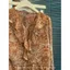 Áo thun dài tay nữ với dây buộc hoa xù, form slim-fit