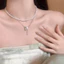 Vòng cổ nữ sang trọng với ngọc trai và tua rua họa tiết bướm vàng