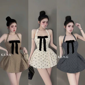 Đầm chấm bi cổ yếm nơ ngực phối chân xoè cực xinh BYJOLIE