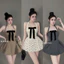 Đầm chấm bi cổ yếm nơ ngực phối chân xoè cực xinh BYJOLIE
