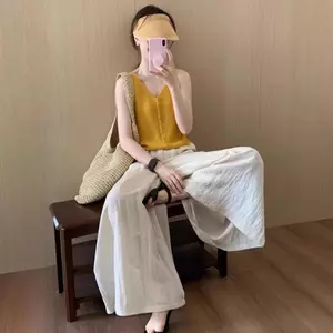 Áo yếm màu vàng phong cách mới, nữ tính, phù hợp mặc ngoài trong mùa hè