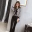 Áo sơ mi cổ chữ V dài tay nữ, thiết kế rộng rãi với chi tiết nơ thời trang