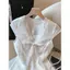 Áo sơ mi ngắn tay màu trắng rỗng thêu ren kiểu Pháp dành cho nữ Mùa hè Phong cách mới Thắt nơ bay