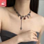 Vòng cổ nữ phong cách gothic và punk với tua rua đỏ zircon hình học
