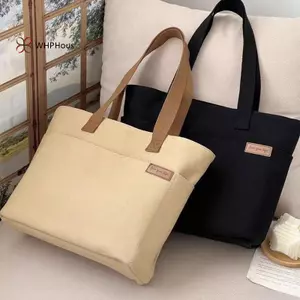 Túi tote vải dành cho nữ, tiện dụng với dây đeo vai và dung tích lớn, phù hợp sử dụng trong lớp học.