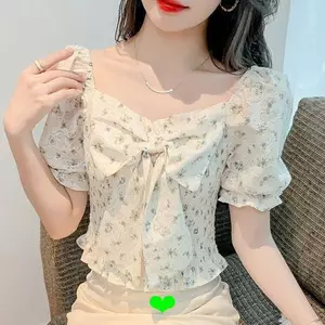 Áo sơ mi nữ hoạ tiết hoa với thiết kế nơ và tay phồng, chất liệu sợi voan phong cách mới