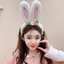 Băng đô tai thỏ trắng và hồng, chất liệu lông giả mềm mại, phù hợp cho lễ hội cosplay và dự tiệc