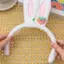 Băng đô tai thỏ trắng và hồng, chất liệu lông giả mềm mại, phù hợp cho lễ hội cosplay và dự tiệc