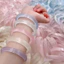 Vòng tay opal nhân tạo VN với họa tiết đám mây nhiều màu sắc, làm sáng tone da, kết hợp bột khoáng tự nhiên và thủy tinh chất lượng cao, phù hợp phong cách nữ nhẹ nhàng.
