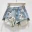Rò Rỉ Túi Quần Frayed Nơ Trang Trí Gợi Cảm Cô Gái Nóng Chữ A Denim Siêu Quần Short Thời Trang Hot Quần