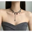 Vòng cổ nữ phong cách gothic và punk với tua rua đỏ zircon hình học