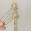 Mới Phong Cách Trung Quốc Ngọc Trai Tua Rua Kẹp Tóc Retro Phong Cách Trung Hoa Rỗng Cuộn Kẹp Tóc Hanfu Phù Hợp Với Tính Khí Cô Gái Mũ Đội Đầu