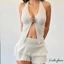 Bộ bikini nữ bao gồm áo ngực hình sao biển, quat và váy xếp lớp