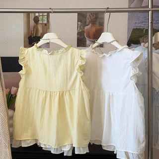 Màu sắc tương phản kem vàng ngọt ngào, áo sơ mi búp bê không tay ren, phong cách Hàn Quốc mới lạ cho mùa hè 2026