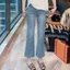 Slit Slimer Look Hơi co giãn eo cao tám điểm đến mắt cá chân Quần jean loe