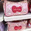 Túi đeo nách màu hồng HelloKitty Nữ hoạt hình dễ thương Túi đeo vai nơ đỏ thời trang di động