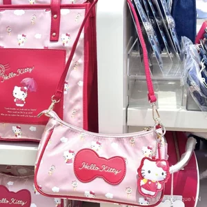 Túi đeo nách màu hồng HelloKitty Nữ hoạt hình dễ thương Túi đeo vai nơ đỏ thời trang di động