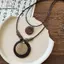 Nhíp cổ điển boho với kim loại và lông vũ, dây xích mặt dây chuyền handmade dành cho nữ