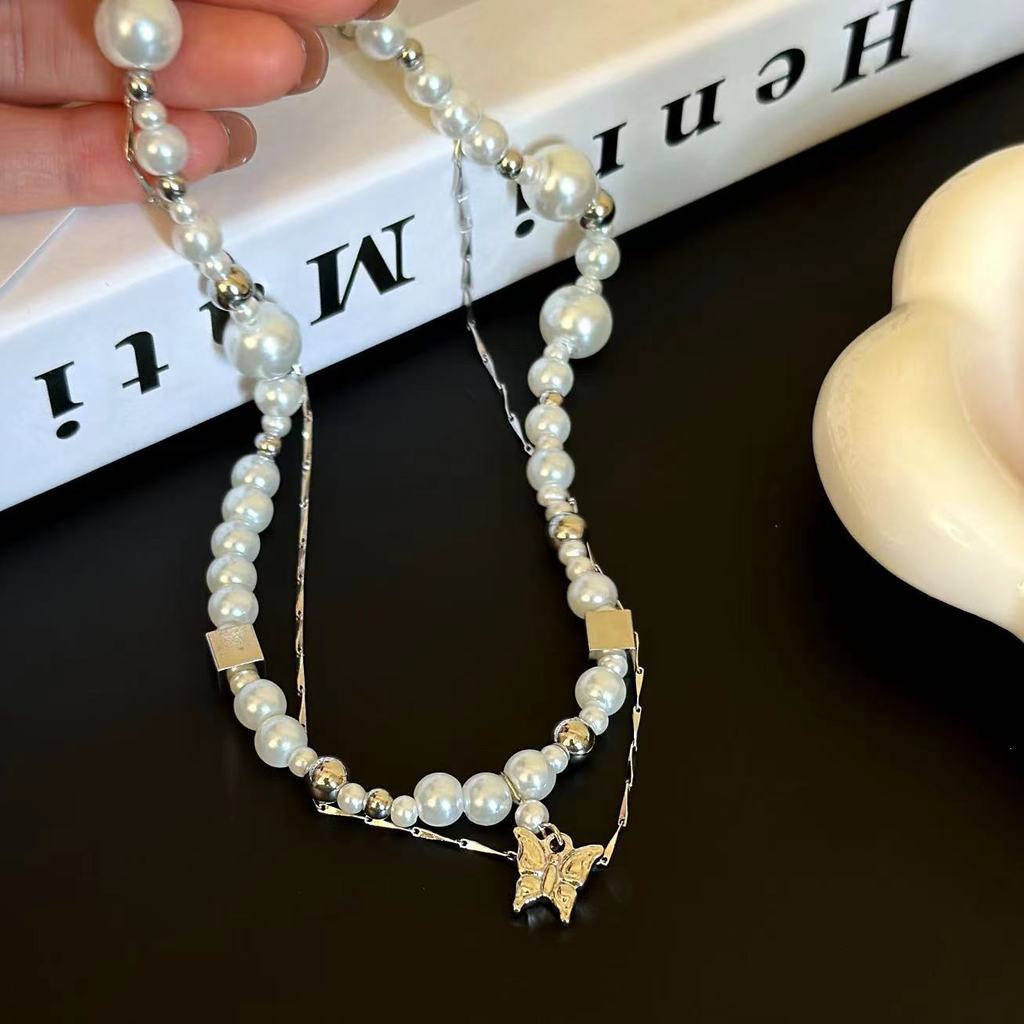 Đáy chuyền nữ thời trang Pháp với ngọc trai và họa tiết bướm, hạt chuông, thiết kế đa năng và cá tính