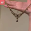 Tính khí cổ điển mới phong cách Trung Quốc giọt nước rỗng mặt dây chuyền màu đen công nghiệp nặng niche và vòng cổ nữ cá tính