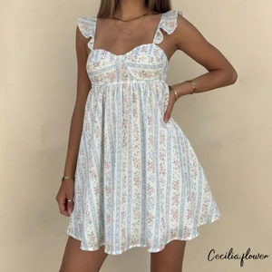 Váy mùa hè nữ Váy Mini không tay in hoa thanh lịch cho kỳ nghỉ