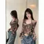 Áo thun dài tay cà vạt không đều dành cho nữ mùa thu Mỹ Hot Girl Halterneck Thiết kế hàng đầu Áo sơ mi đáy Niche Trận đấu bên trong