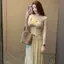 Tính khí mỏng hơn trông eo cao xếp ly xã hội Bộ đồ nữ cổ tròn dệt kim Top Váy thời trang phù hợp cho nữ