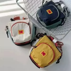 Túi đựng máy ảnh Kodak cho bé gái Thể thao di động ngoài trời Kodak chống nước Phong cách Nhật Bản Màu sắc tương phản Túi đeo chéo dây rút ccd