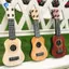 Đồ chơi đàn guitar Ukulele cổ điển dành cho trẻ em màu vàng Giáo dục sớm Đồ dùng dự tiệc đàn guitar nhỏ có thể điều chỉnh