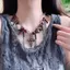 Vòng cổ nữ Gothic với tua rua chéo và hạt đen, thiết kế mát mẻ và cá tính