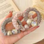 Dây buộc tóc nữ zircon giả ngọc trai xếp ly, ánh sáng sang trọng, thời trang mới 2026