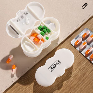 Hộp đựng thuốc mini cầm tay 4 ngăn đa chức năng dễ vệ sinh, tích hợp dao cắt thuốc.
