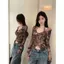 Áo thun dài tay cà vạt không đều dành cho nữ mùa thu Mỹ Hot Girl Halterneck Thiết kế hàng đầu Áo sơ mi đáy Niche Trận đấu bên trong