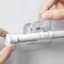 Set 2 kẹp cố định thanh treo dán tường trong suốt, giữ chắc chống tuột tiện dụng