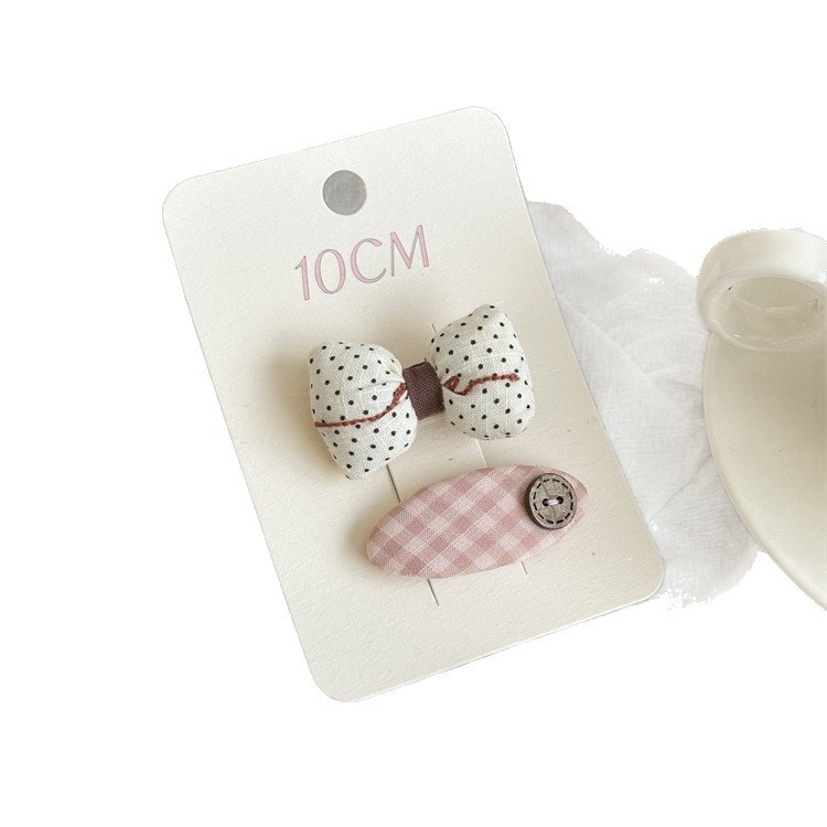 Kẹp tóc chấm bi cho bé gái