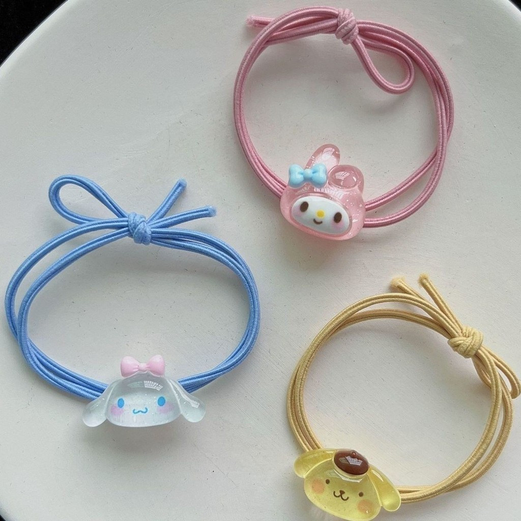 Dây buộc tóc Sanrio trong suốt dễ thương với nhiều màu sắc từ cao su mềm mại, bao gồm nhân vật yêu thích như Cinnamoroll, Kuromi và My Melody