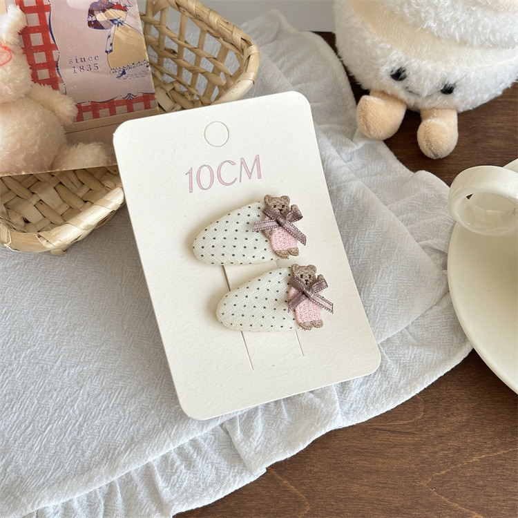 Kẹp tóc chấm bi cho bé gái