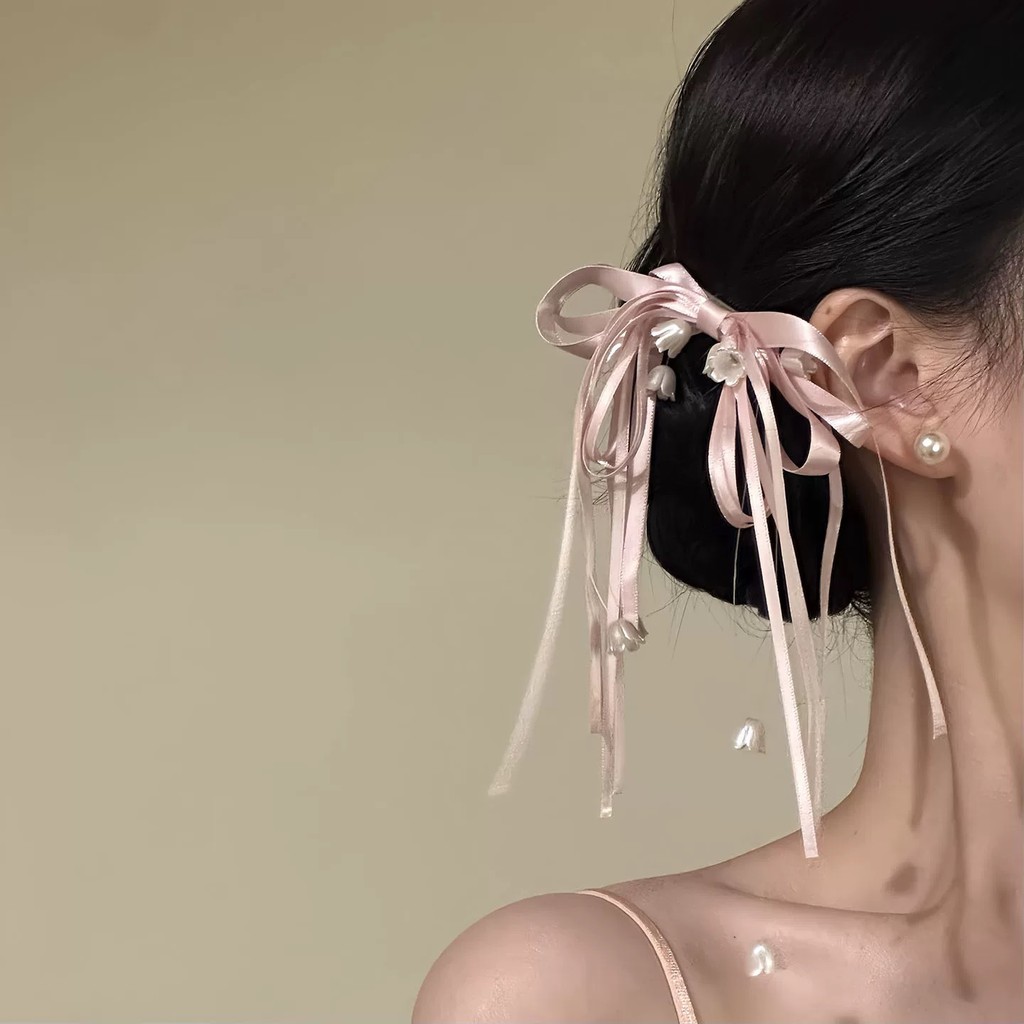 Kẹp tóc hoa huệ màu hồng thanh lịch của thung lũng và nơ dành cho nữ