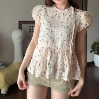Áo Flower hoa nhí babydoll cổ tròn màu kem phối dây nơ điệu đà màu sắc nữ tính 2026 siêu hot