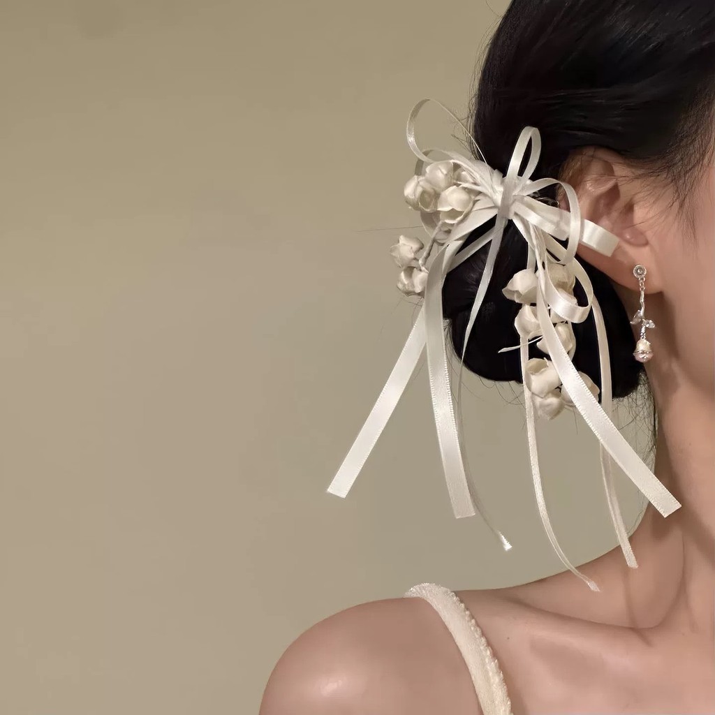 Kẹp tóc hoa huệ màu hồng thanh lịch của thung lũng và nơ dành cho nữ